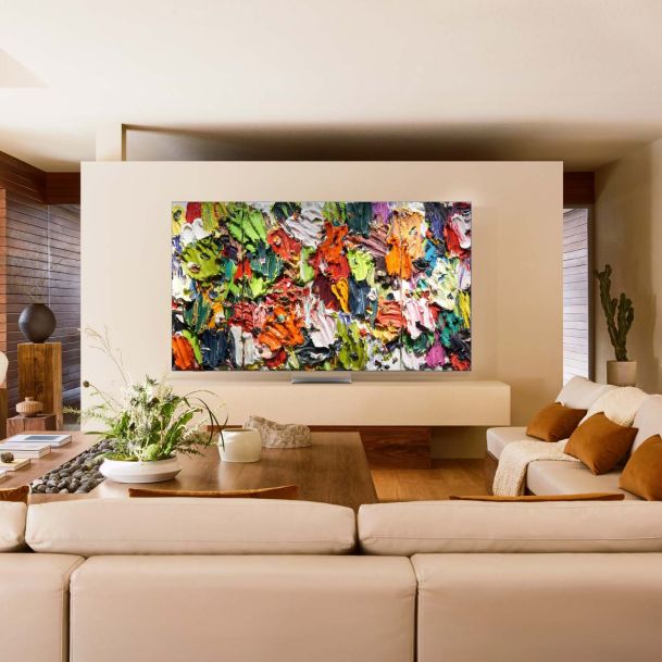 Colorful artwork on a samsung TV on a beige wall