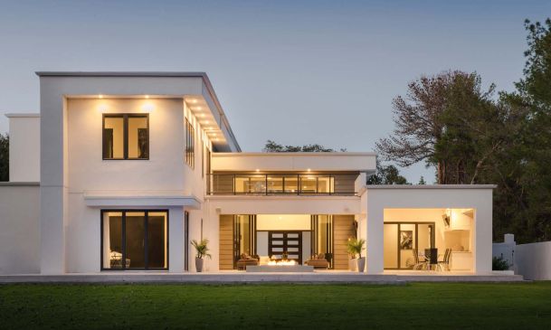 Modern home with lighting at dusk